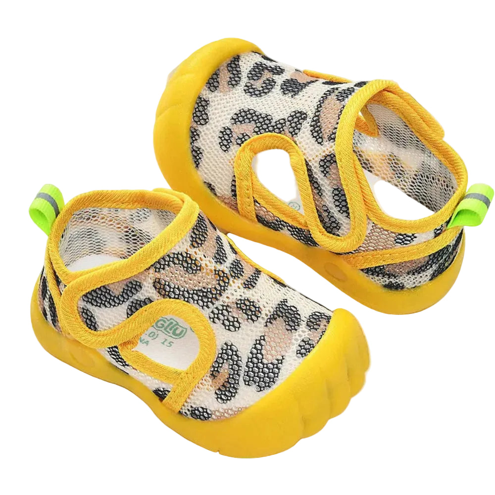 Pair of baby shoes with leopard print and yellow accents on a white background